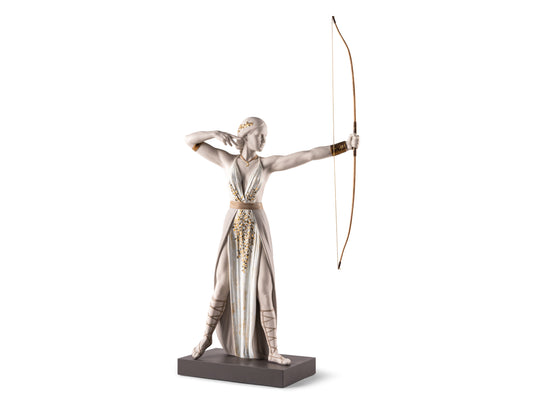 A white matte porcelain figure of the goddess Diana wearing white and gold robes and poised as if she'd just fired an arrow from the bow she holds in her left hand