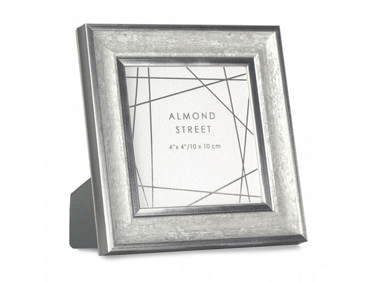 a moulded square silver photo frame