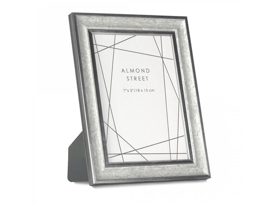A silver and dark grey frame with a moulded surround