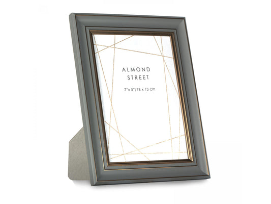 A dark grey moulded frame with copper detailing
