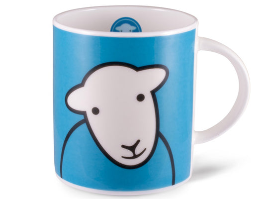 A straight-sided fine bone china mug featuring a solid blue background with a cartoon style line illustration of a Herdwick sheep face with a white face and blue wool body on the front and back. The handle is white, and inside the mug's rim, there is a circle of blue with a full white sheep face sat inside.
