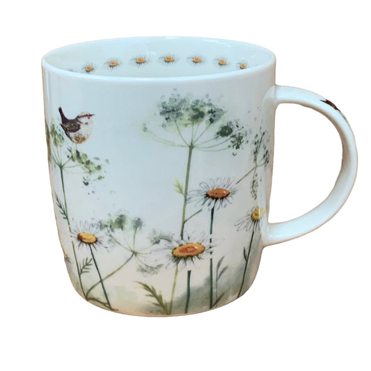 This Alex Clark mug is illustrated with a meadow of white cow parsley flowers & a little bird.   This mug also features a flower illustration around the inside rim & illustrations down the handle.  