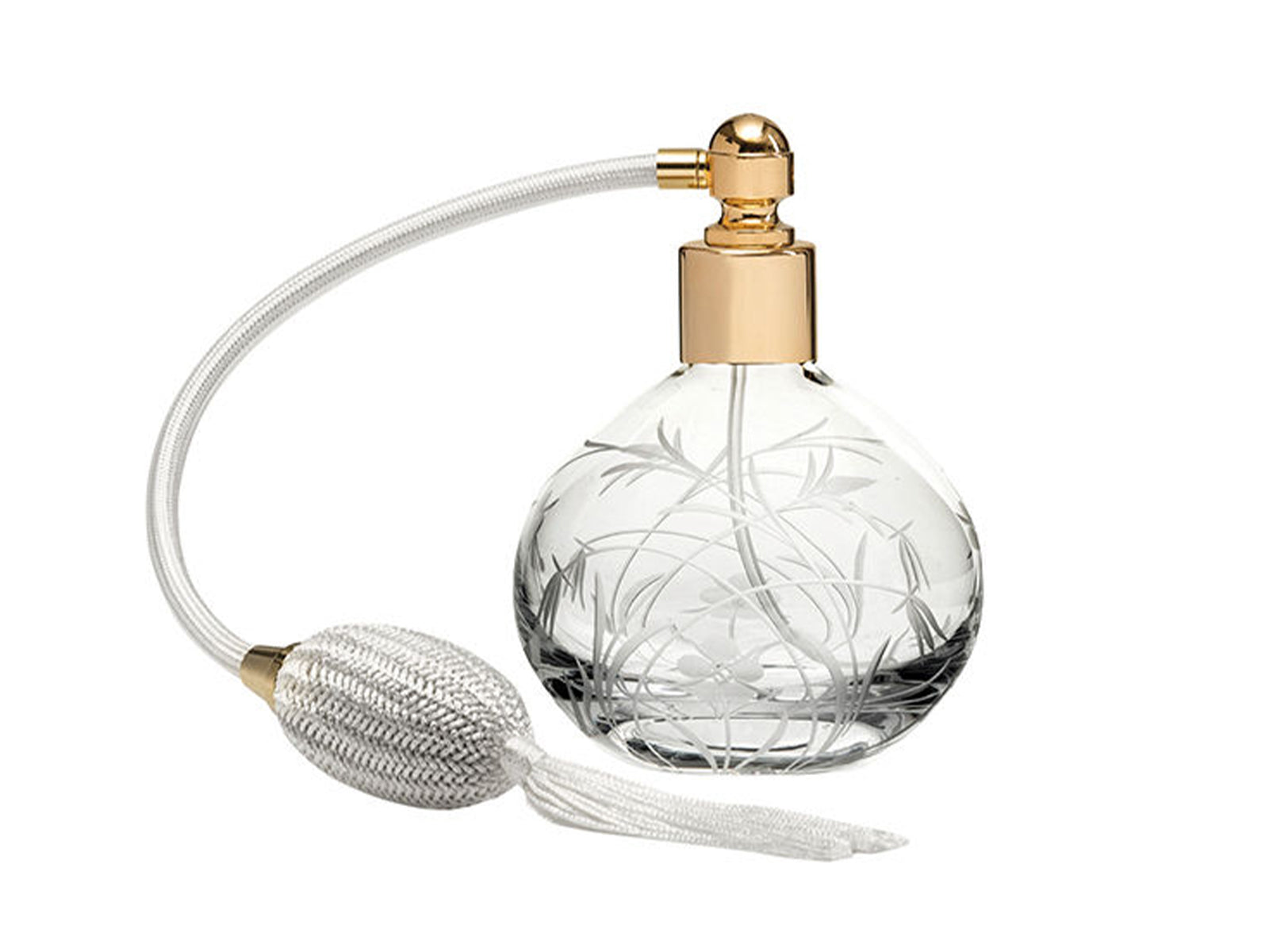 A round crystal perfume bottle with a gold lid and a cream atomiser. It has a wildflower design cut into the exterior, giving a frosted effect.
