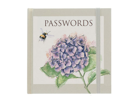 A small green square book with a hydrangea and flying bee on the front, kept shut with a green elastic strip