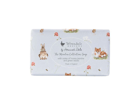 A bar of soap wrapped in a light blue paper with woodland animals on it