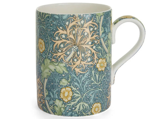 Crafted from fine bone china, it showcases the extraordinary Seaweed design from Morris &amp; Co.'s archive, boasting striking jewel-like colourways. 