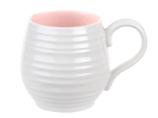 The Sophie Conran Pink Honey Pot Mug is made of white porcelain with a rippled texture and pink interior