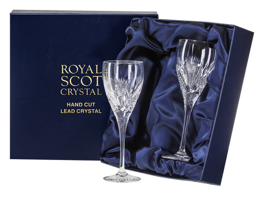 A pair of delicate stemmed port glasses with a scottish thistle design cut into the outside. They come in a navy blue silk lined presentation box with gold branding on the lid