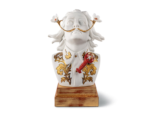A bust of Salvador Dali made with white, gold, platinum and red finishes. He has an ornate lapel with a red lobster on it and daffodils on the end of his mustache