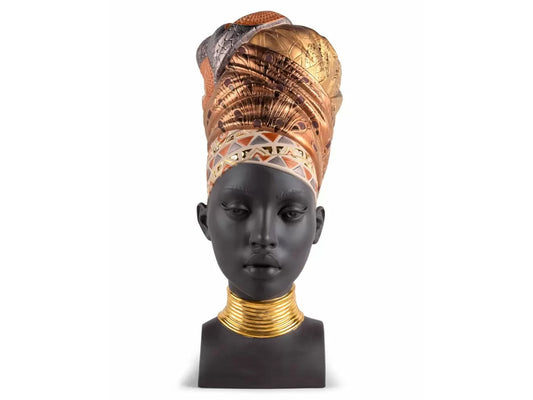 A matte black porcelain bust of a woman's head with an elaborate gold and copper headscarf and gold rings around her neck