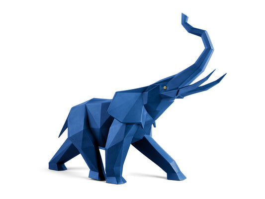 An origami elephant figure made of porcelain and finished in a matte blue