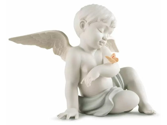 A white matte porcelain figure of a young cherub, dressed in nothing but a slightly green loin cloth. His wings are out behind him and he has one arm raised across his chest, with a pastel butterfly perched on it. The cherub is sitting down, leaning on one hand with one knee propped up to his side.