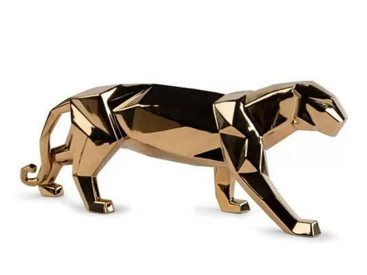 A geometric panther sculpture in a metallic gold finish