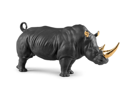 A matte black rhino with gold details on the horns and ears