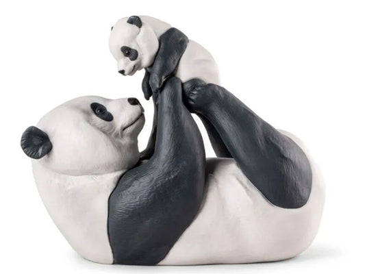 his heartwarming portrayal of a mother panda and her cub captures a tender moment. Crafted in matte porcelain
