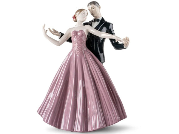 exquisite porcelain figurine is a testament to the remarkable craftsmanship of our artists. It beautifully depicts a couple engaged in a graceful dance, perfectly synchronized with the music's rhythm. The figurine, known as "Anniversary Waltz," exemplifies the skilful storytelling ability of our artists, who have the remarkable talent to convey deep emotions through their sculptures.