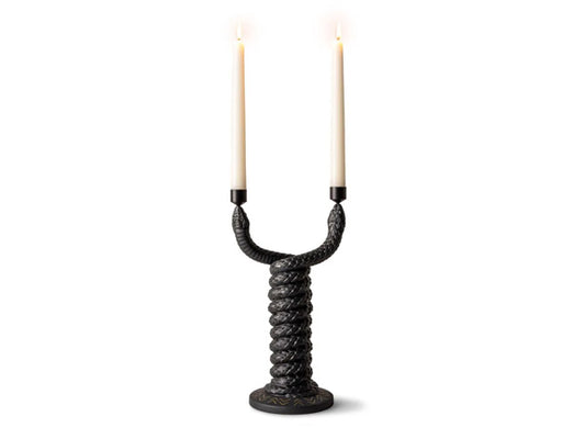Indulge in our Snakes Collection's Matte Black Porcelain Candleholder – a stunning addition to your decor. Snakes, with their captivating aura, have long fascinated and intrigued humanity, igniting imagination and occasionally evoking fear. Across diverse cultures, they symbolize the eternal life cycle, wisdom, knowledge, spirituality, as well as power and protection.