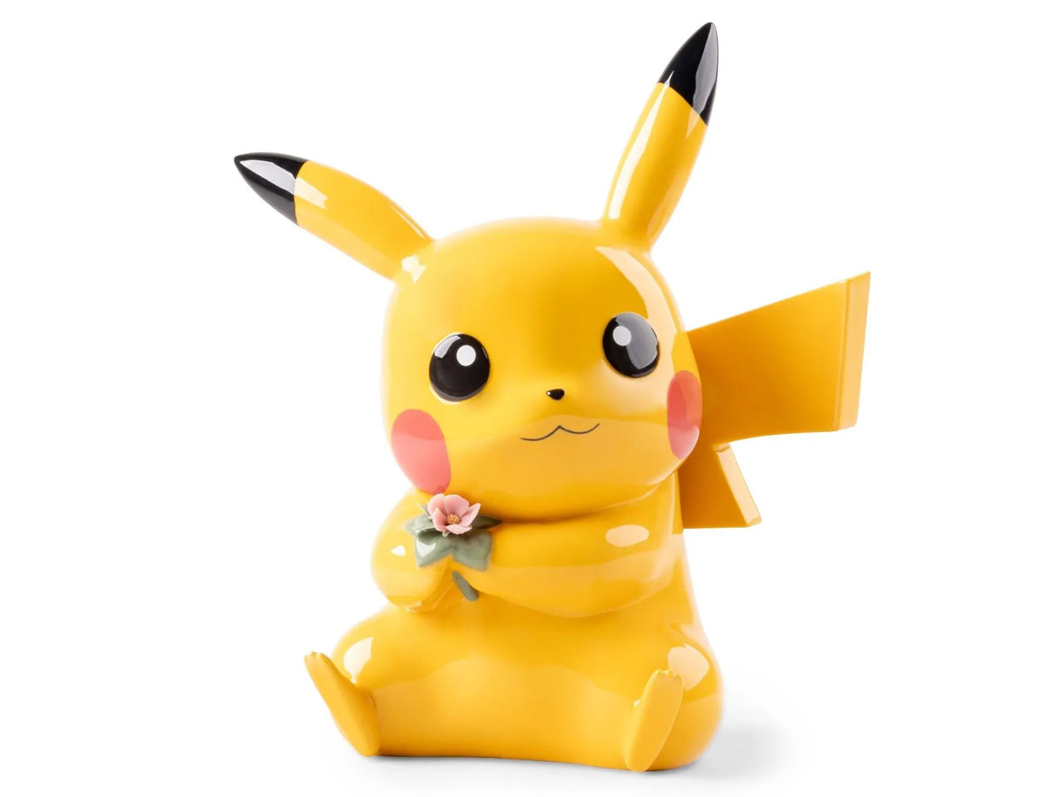 Lladró Pikachu numbered edition porcelain sculpture holding a small flower, handcrafted Pokémon collectible, product code 01009816.