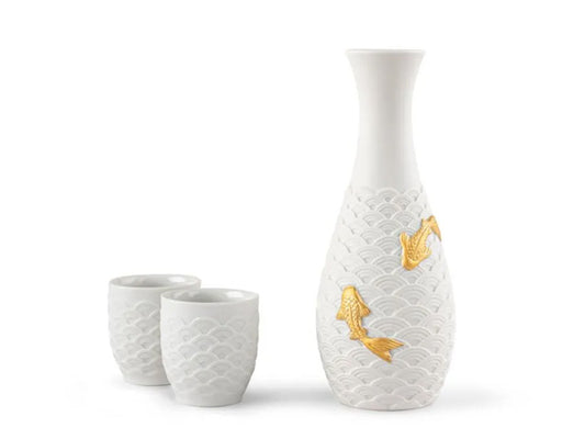 We're pleased to introduce a new addition to our Koi collection – a sake set featuring a porcelain bottle and two cups. This collection draws inspiration from the world's beloved ornamental fish, the koi, symbolizing love and friendship. Crafted in white porcelain, all three pieces exhibit a matte exterior finish complemented by a glossy interior. 