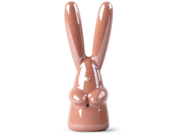 Lladro pink Ceramic rabbit-shaped object on a white background