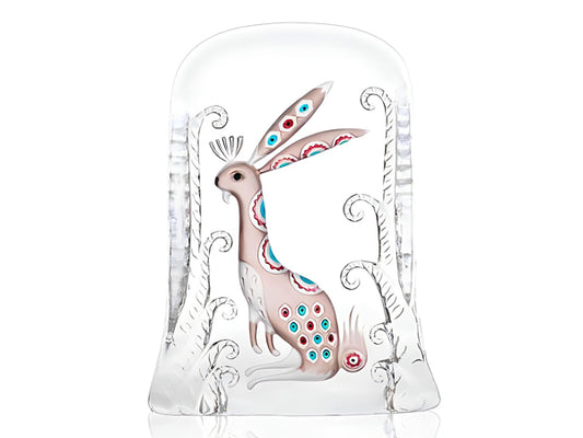 A crystal sculpture of a painted Nordic mythology hare. The hare is painted in a flesh tone with bright spots of blue and red in an assorted pattern.