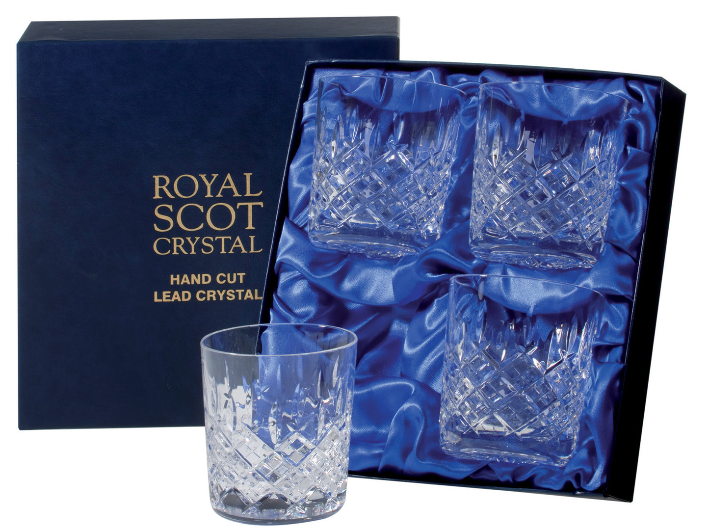 A set of four crystal whisky glasses, each engraved with a bed of diamonds at the base and single flicks reaching up towards the smooth rim. They come in a navy blue silk-lined presentation box with gold branding embossed on the lid.