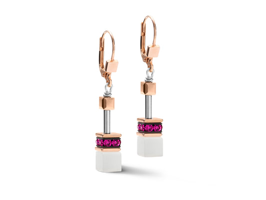 A pair of square drop earrings on rose gold hooks with a hinged clip on the back. The drops are made of fuchsia swarovski crystals and a white cube at the base