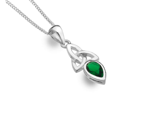 A silver necklace with a rich green teardrop stone