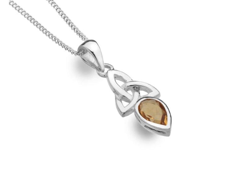 A silver necklace with a fine chain and a knotted pendant with a citrine stone