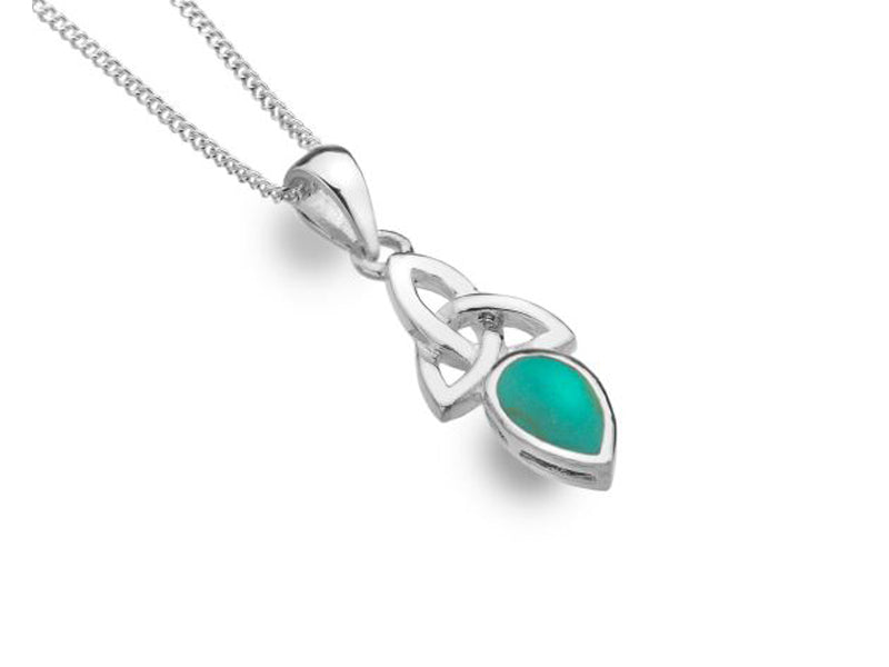 A silver necklace with a cletic knot and a turquoise gem