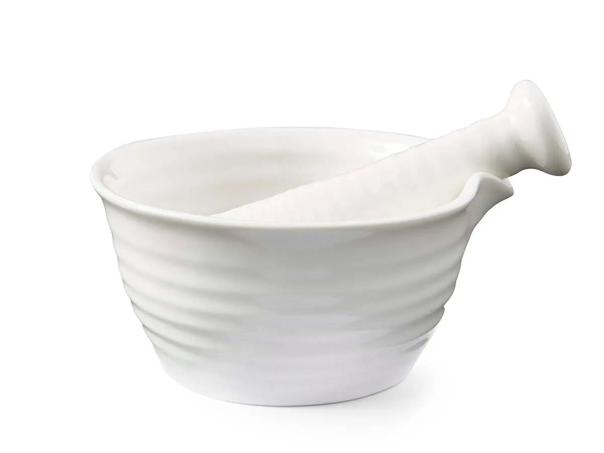 White porcelain Sophie Conran pestle and mortar with textured ripple finish and matching pestle.