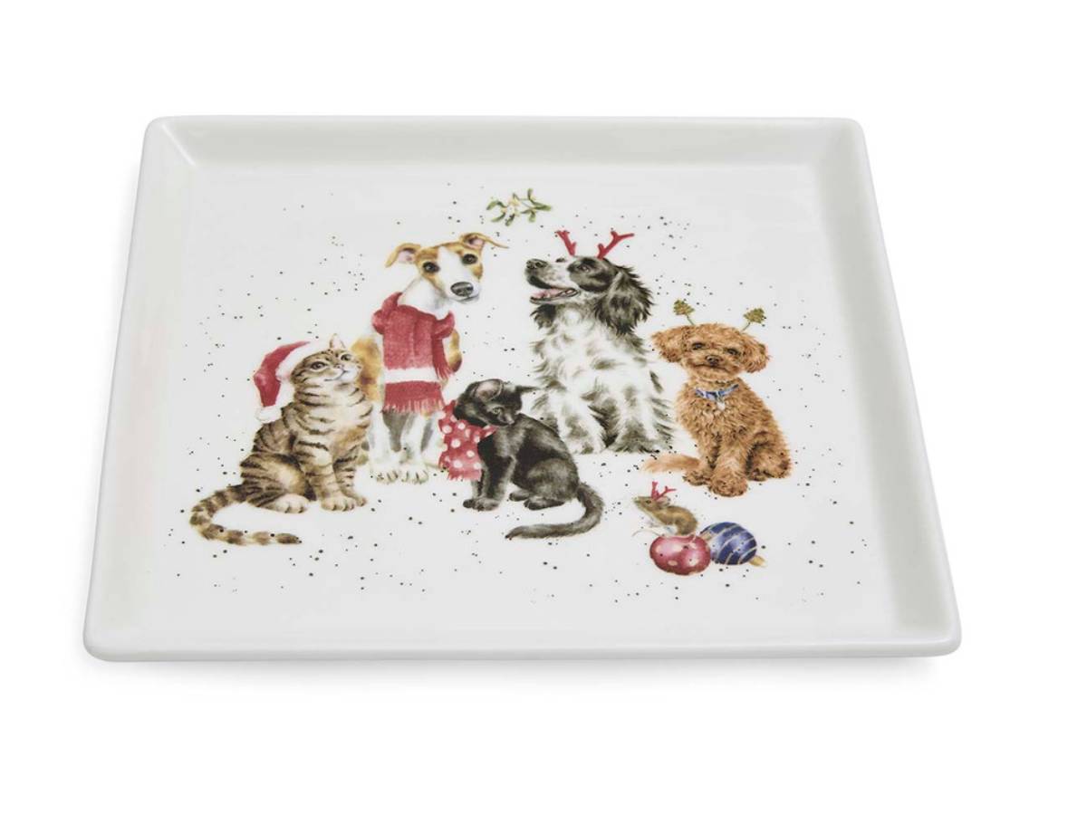 A square white ceramic serving tray featuring a festive illustration of several dogs and a cat wearing Christmas clothing, set against a plain white background.