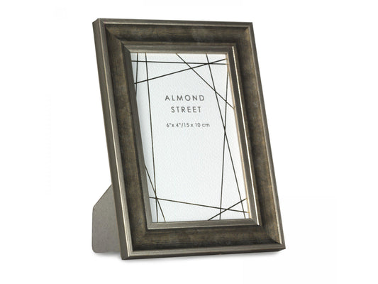 A dark grey/brown photo frame with gold detailing around the edge