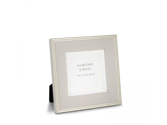 A light taupe square photo frame with gold detailing