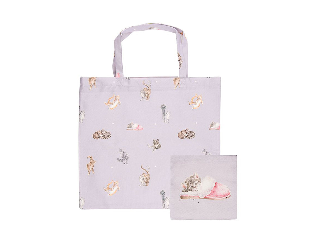 A light purple fabric shopping bag with various cat designs on it, which can be folded into a small square pocket that is shown alongside it