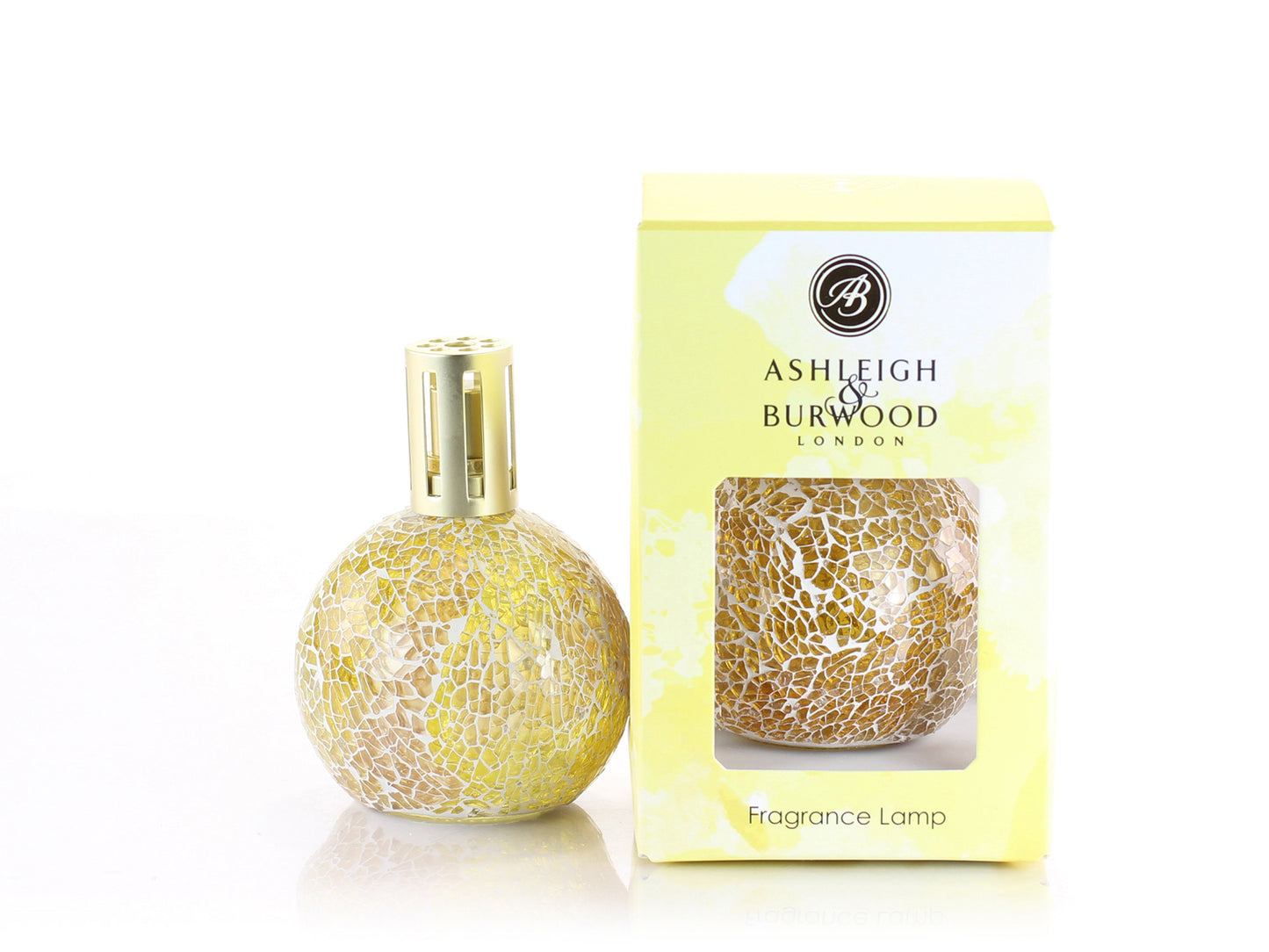 A yellow glass fragrance lamp made up of small pieces of glass set in a mosaic style, with a gold lid. It comes boxed in a yellow and white marbled box.