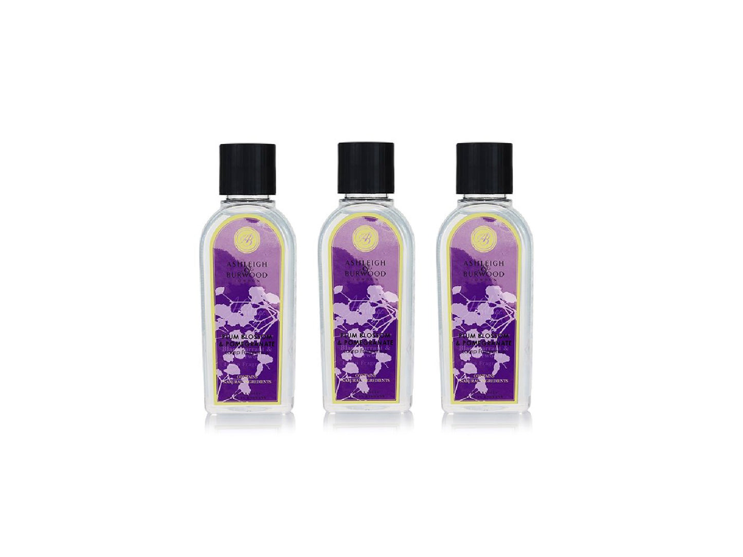 Three bottles of plum blossom and pomegranate lamp fragrance with floral purple labels, clear bottles and black caps.