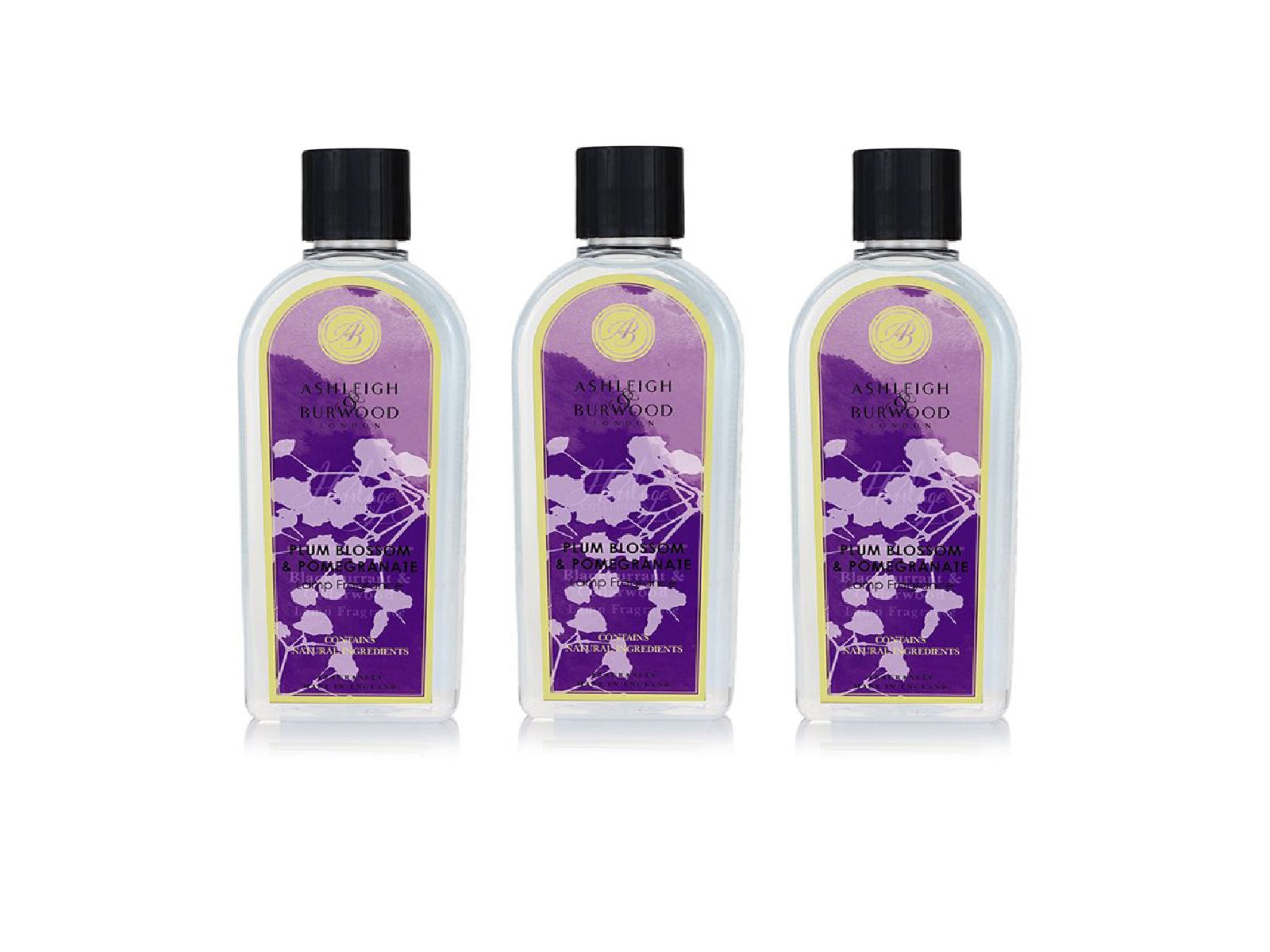 Three bottles of plum blossom and pomegranate scent with clear bottles, floral purple labels and black caps