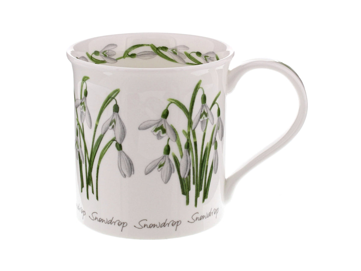 Dunoon Bute Spring Flowers Snow Drop Mug is a fine bone china mug that is printed with bright depictions of the snow drop flower around its exterior, as well as a snow drop floral chain around the inner rim of the mug and down its handle.