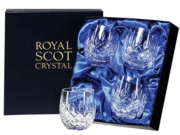 A set of four barrel tumblers in a navy blue silk-lined presentation box. Each tumbler is engraved with a bed of diamonds at the base and has single flicks going up towards the smooth rim