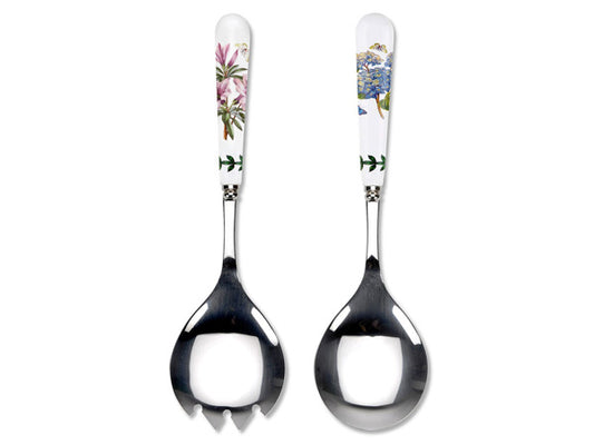 Porcelain and stainless steel salad server pairs, one large spoon and one pronged spoon. Each handle has an illustration of a different plant, one a Lily Flowered Azalea and the other an African Lily illustration.