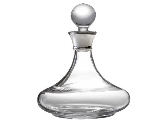A smooth crystal ships decanter that has a wide base, slender neck and a round stopper