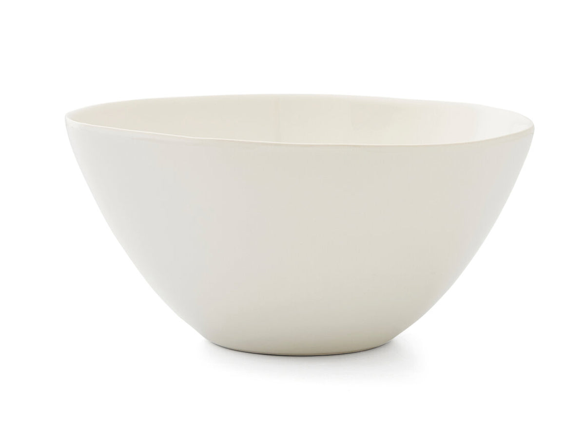 A large cream porcelain serving bowl that is part of Sophie Conran's Arbor range. The bowl has been shaped naturally and is unevenly rounded, and has been finished with a clear glaze to make it microwave, oven, freezer and dishwasher safe.