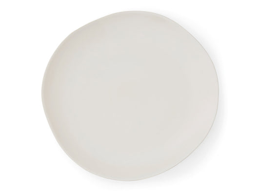 A large sharing platter made from cream porcelain that has unevenly round edges where it is mimicking the naturally occurring shapes found in nature. It is perfect for serving up sweet or savoury canapes, as well as a large roasted joint of meat to share as a main course.