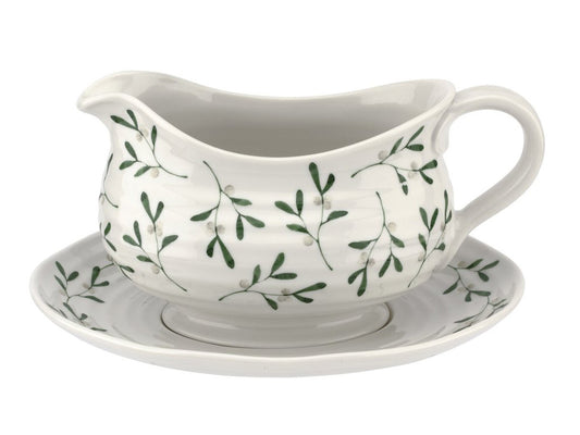 A gravy boat and stand set that is part of Sophie Conran's mistletoe range. Made of a white porcelain, the pieces have been textured with a ripple effect and decorated with a delicate mistletow print around the body of the jug and the outer rim of the stand. The boat is capable of holding up to a pint of gravy.
