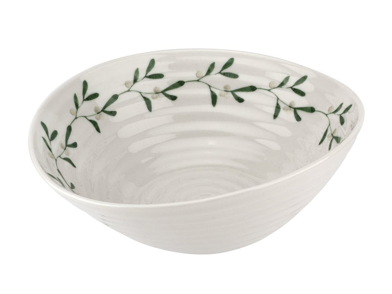 A white porcelain bowl that has been designed with Sophie Conran's staple ripple design. Around the inner rim of the bowl can be found a chain of mistletoe leaves, and the bowl is the ideal size for serving up a hearty portion of cereal.
