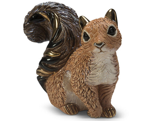 Handcrafted De Rosa red squirrel porcelain figurine with textured copper-toned fur, bushy metallic bronze tail, cream chest, and glossy black eyes, sitting upright against a white background.