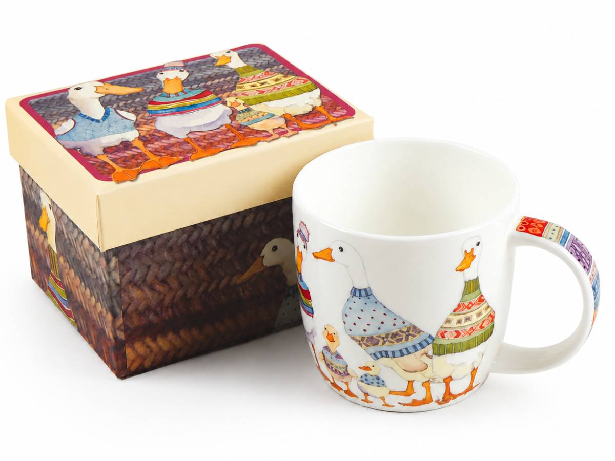 A white ceramic mug and its matching decorative gift box, both featuring a whimsical duck family illustration in colorful knit clothing on a white background.
