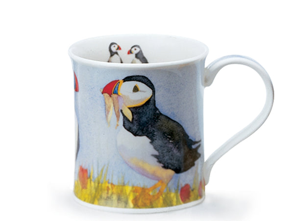 Dunoon Bute Shoreline Puffin mug featuring an illustrated puffin on a soft blue background