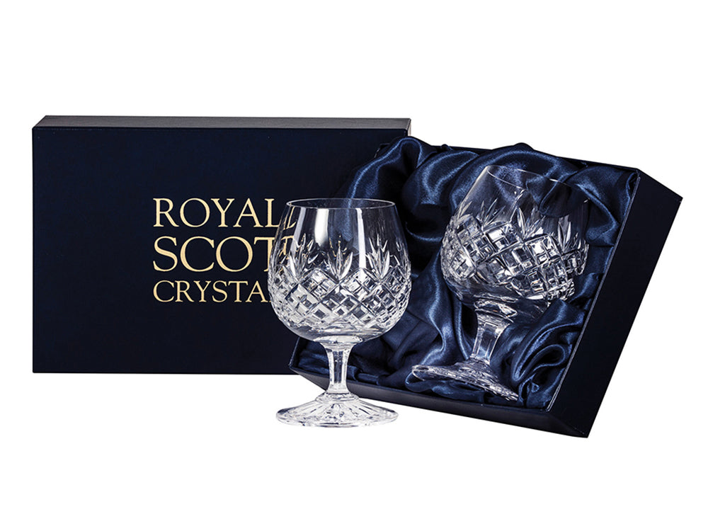 Pair of Royal Scot Crystal Edinburgh Brandy Glasses are hand-cut in Britain with the staple Edinburgh design and crafted from a fine crystal. The glasses are short-stemmed and have a rounded base.